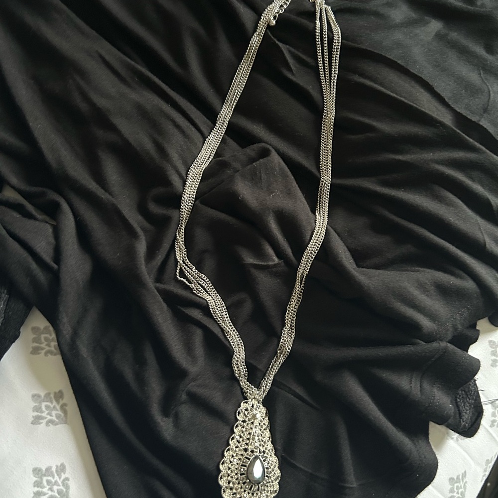 Elegant Silver Necklace with Intricate Pendant